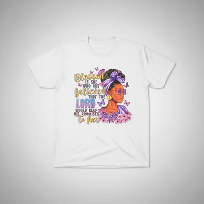White t-shirt with a colorful graphic of a woman and text on a gray background